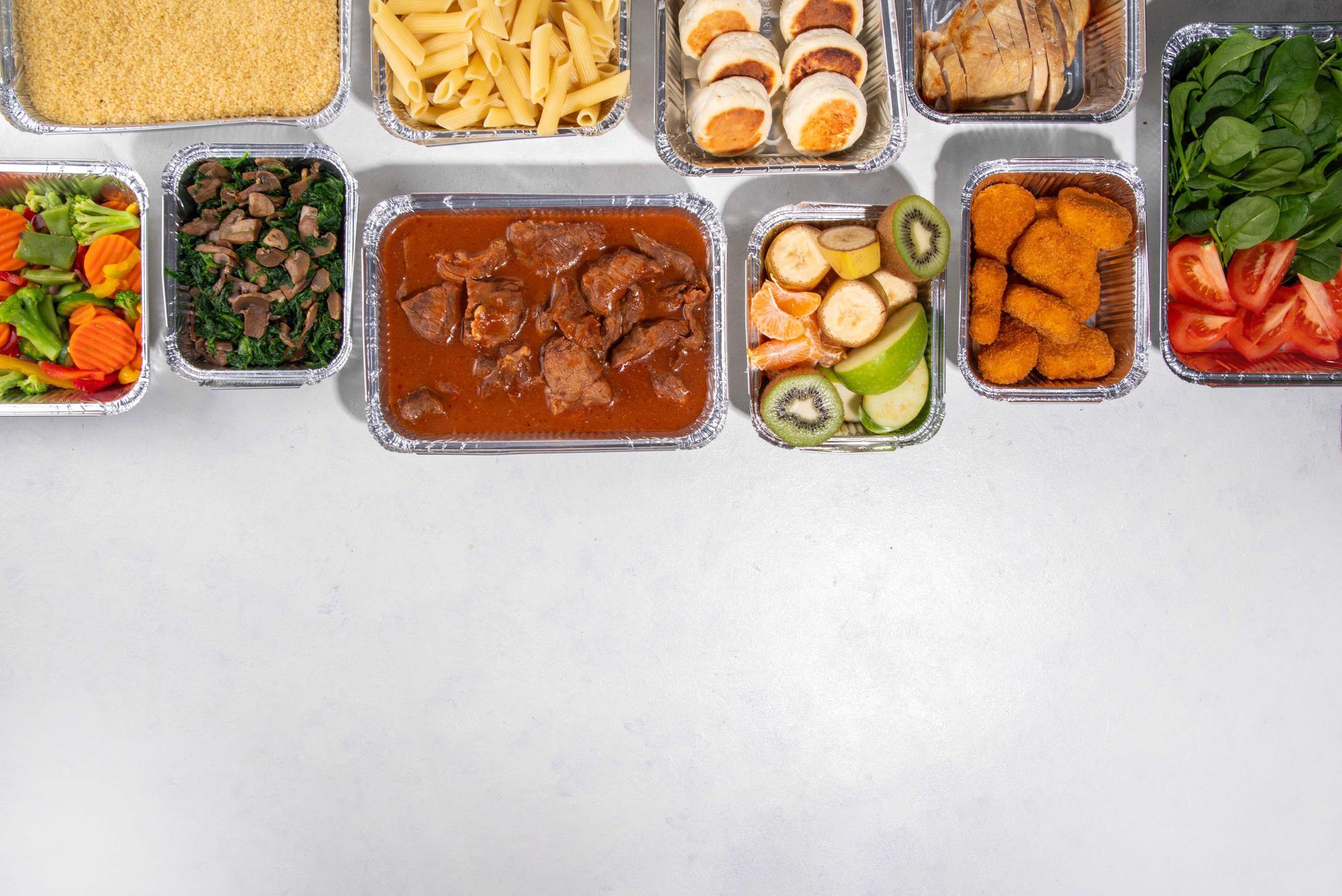 Assorted prepared meal boxes on a counter