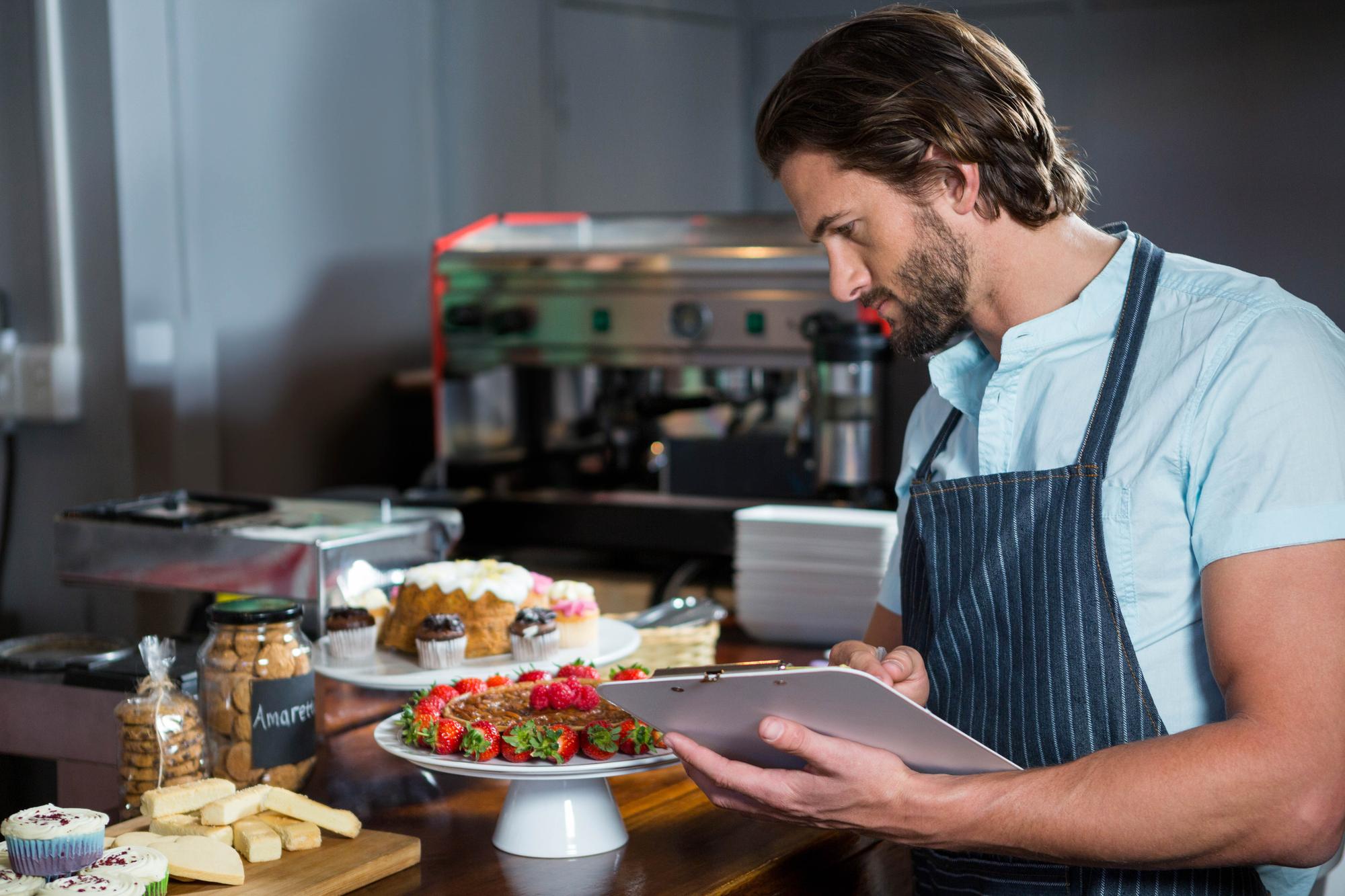 Chef consulting menu on tablet